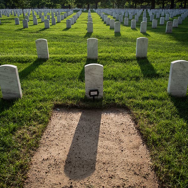 A grave in Section 60 was newly covered after a recent burial of a veteran’s spouse. To save room, the cemetery now stacks family members in a single plot rather than burying them side by side.